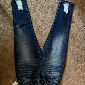 Black label buckle skinny distressed ankle jeans.